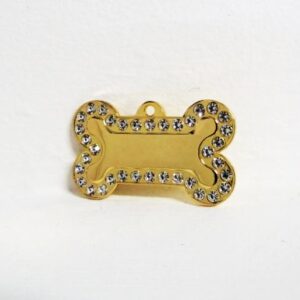 PLACA HUESO GRANDE DORADA CON PIEDRAS